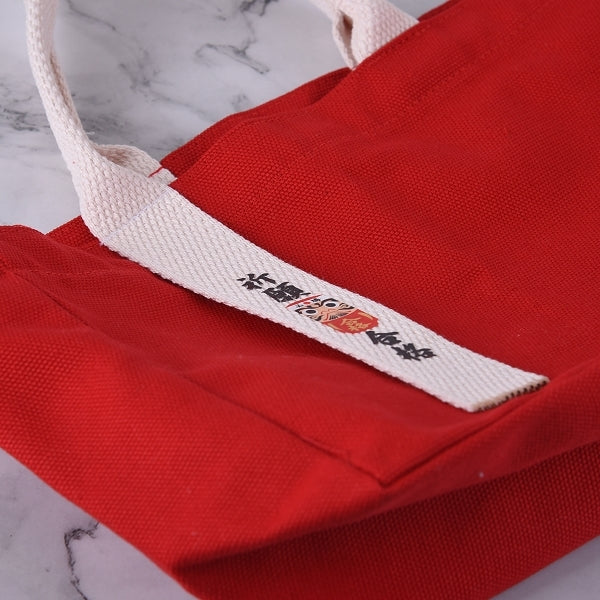 紅色帆布單飄帶立體手提包